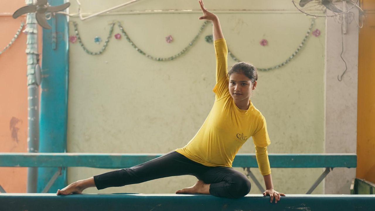 a teen girl practicing gymnastics